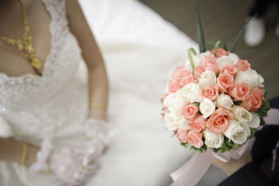 Close-up of rose holding bouquet