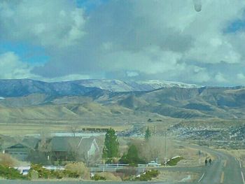 Scenic view of landscape and mountains against sky