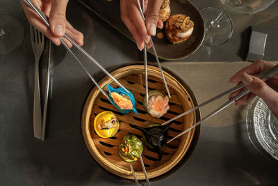 Cropped hand of man preparing food