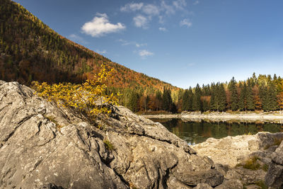 Upper lake of fusine, tarvisio. autumnal fire reflections. at the foot of the mangart