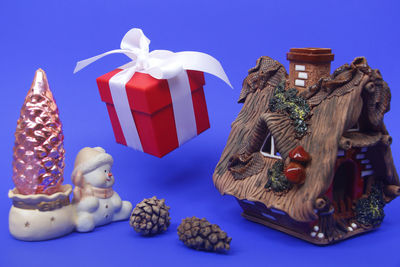 View of christmas decoration in box against blue background