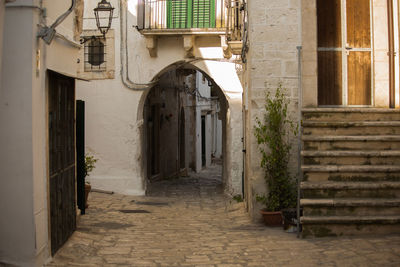 Narrow alley amidst buildings in town