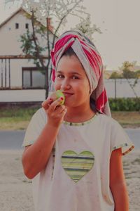 Portrait of cute girl standing outdoors