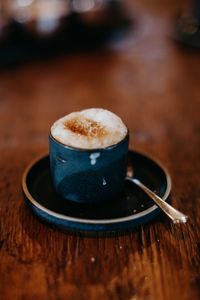 Close-up of cappuccino on table