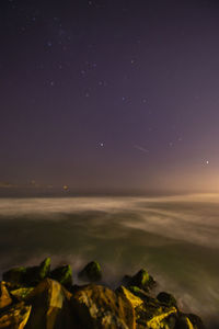 Scenic view of sea against sky at night