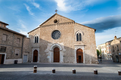 Facade of historic building against sky