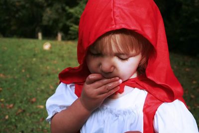 Girl dressed as red riding hood