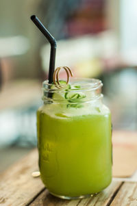 Close-up of drink in jar on table