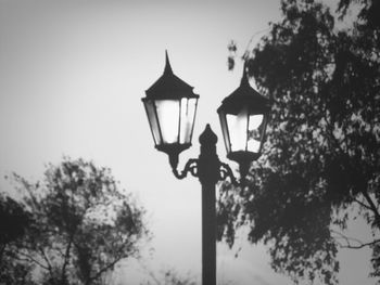 Low angle view of street light against sky