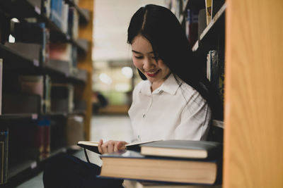 Young woman reading book