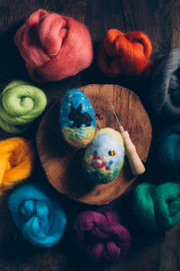 High angle view of multi colored eggs on table