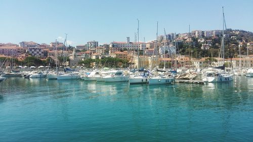 Boats moored in sea