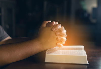 Close-up of hand holding book