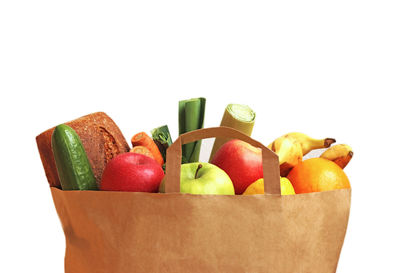 Close-up of fruits and vegetables on white background