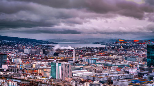 High angle view of city buildings against sky