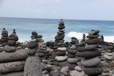 Stack of stones against calm sea