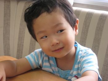 Close-up portrait of boy at home