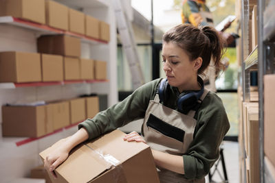 Side view of young man working in office