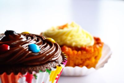 Low angle view of cupcakes against white background