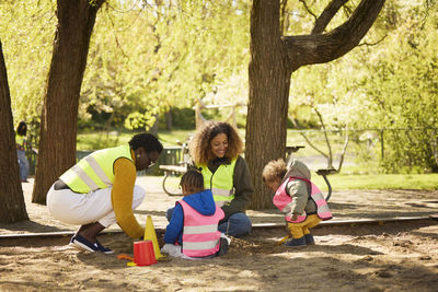 Volunteer playing with family in park