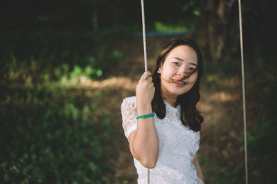 Portrait of beautiful woman standing outdoors