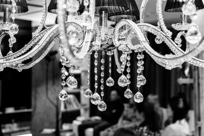 Close-up of chandelier hanging in store