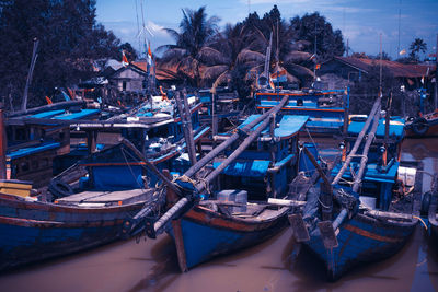 Boats moored at harbor