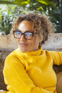 Portrait of young woman wearing sunglasses
