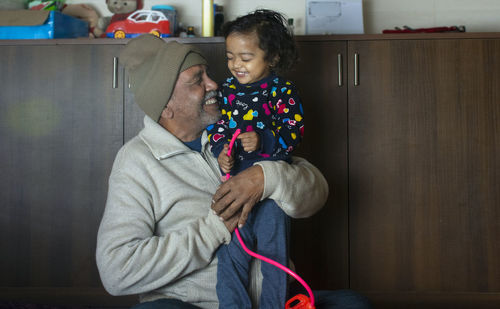 Boy holding father