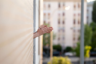 Person hand on glass window