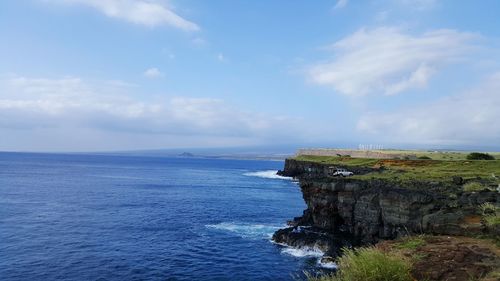 Scenic view of sea against cloudy sky