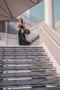 Woman standing on staircase