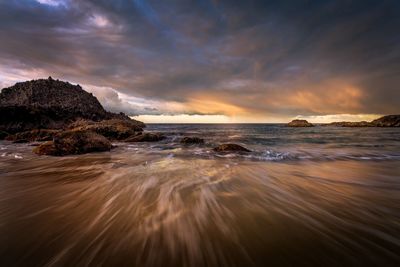 Scenic view of sea against sky during sunset