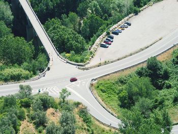 High angle view of road amidst trees against sky