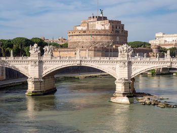 Arch bridge over river in rome