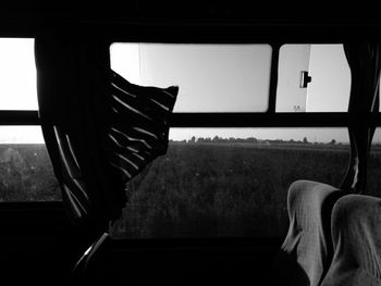 Field seen through bus window