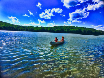 Man on boat in lake