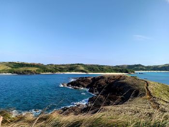 Scenic view of sea against clear blue sky