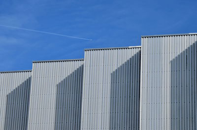 Low angle view of building against blue sky