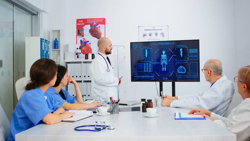 Female doctor examining patient at clinic