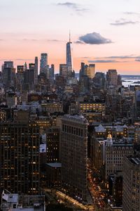 Aerial view of city buildings during sunset
