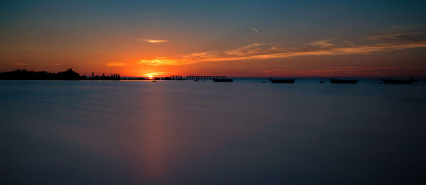 Scenic view of sea against sky at sunset