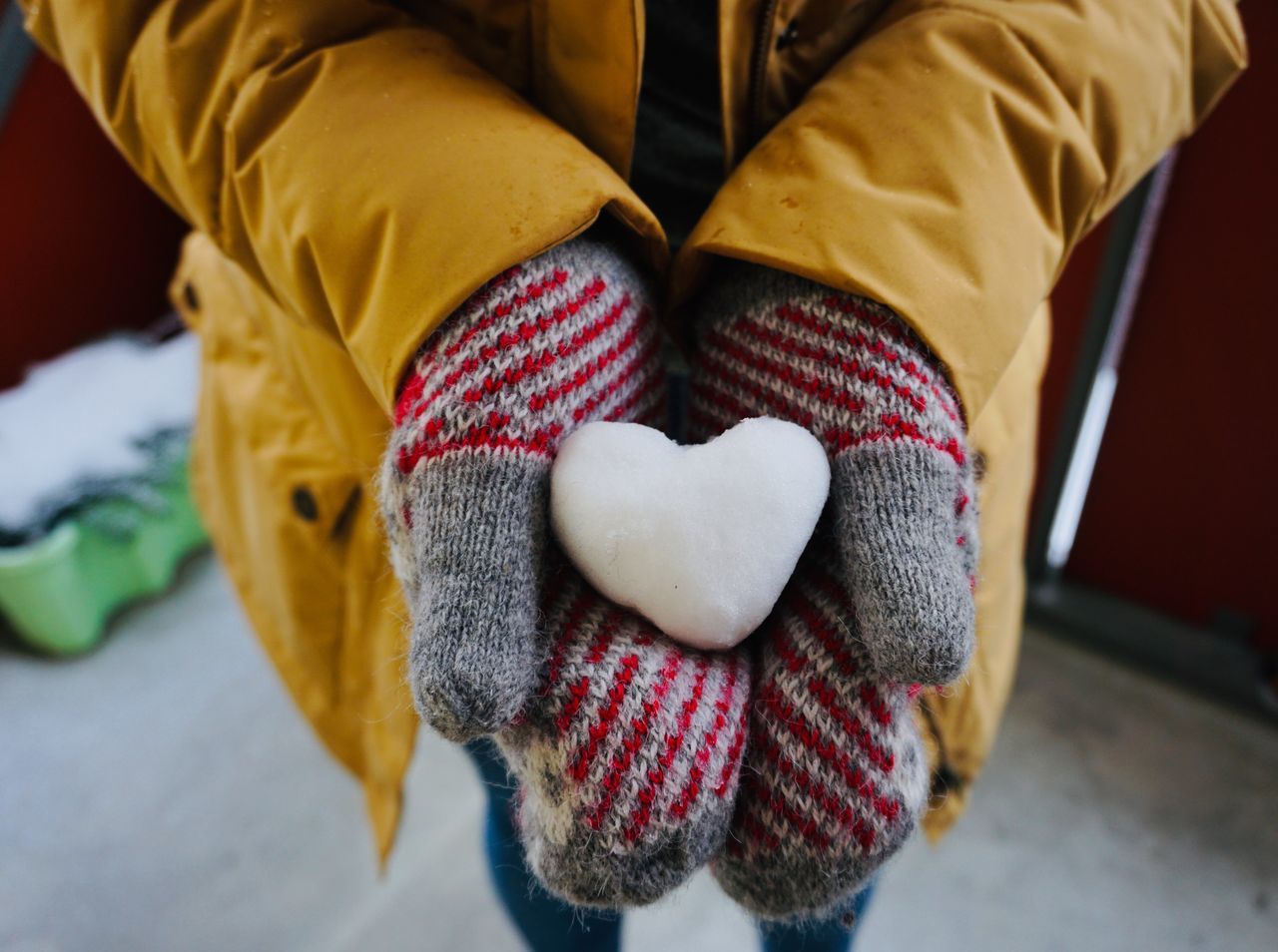 one person, human hand, human body part, midsection, hand, love, real people, heart shape, lifestyles, holding, positive emotion, focus on foreground, childhood, emotion, child, body part, indoors, high angle view, women, warm clothing, human limb, finger