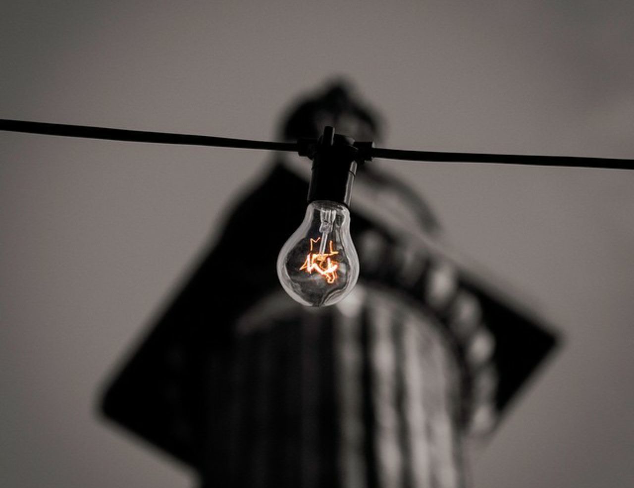 hanging, lighting equipment, electricity, low angle view, light bulb, electric bulb, cable, no people, close-up, illuminated, indoors, filament, sky, day