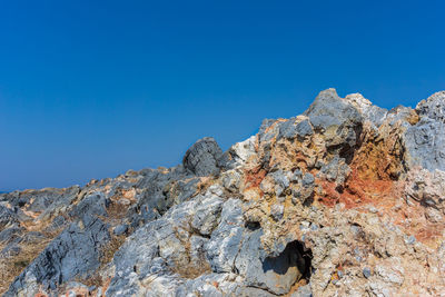 Scenic view of mountain against clear blue sky