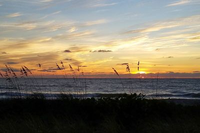 Scenic view of sea against sky during sunset