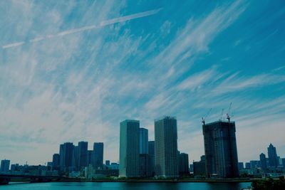 Modern buildings in city against sky
