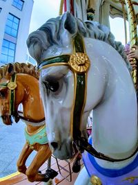 Close-up of horse sculpture in amusement park