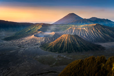 Panoramic view of volcanic landscape against sky during sunset