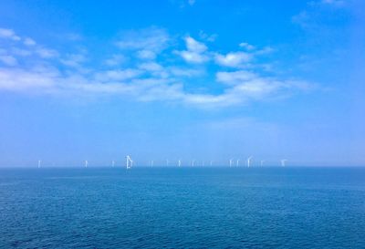 Scenic view of sea against blue sky